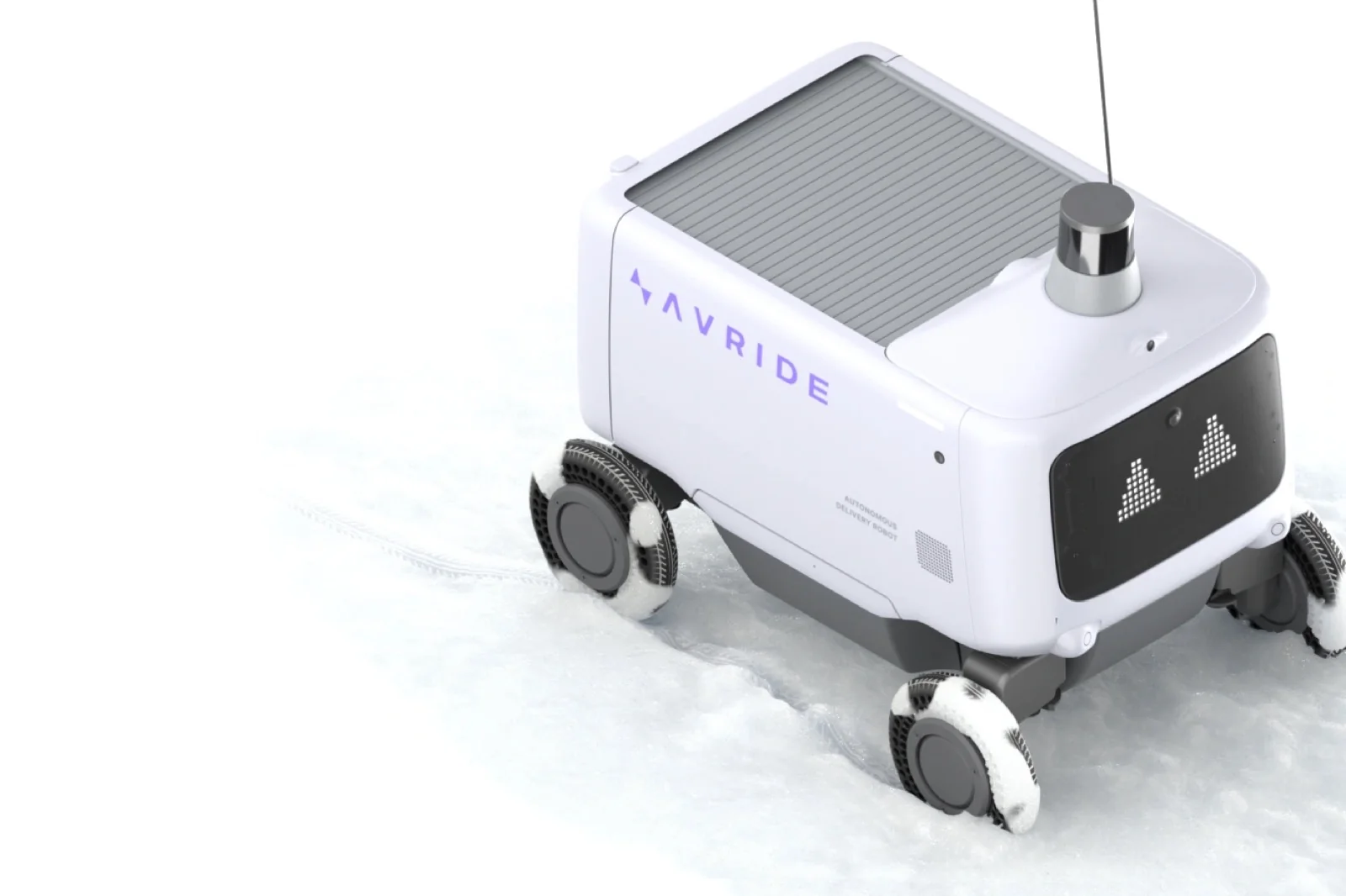 Avride product image of its white 6-wheeled sidewalk delivery robot driving through snow, with the Avride name on the side and a lidar sensor on top